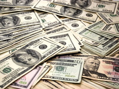 Dollar retreats from one-month high as traders eye Biden's FX policy